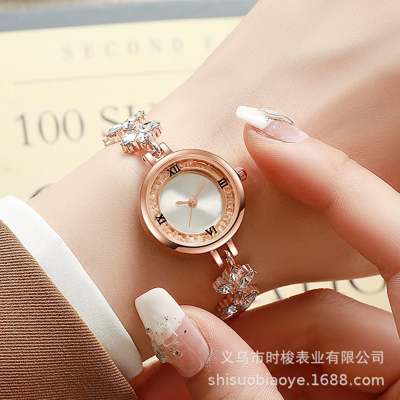 Fashionable Alloy Women's Bracelet Watch With Rhinestone Ball Quicksand And Round Dial