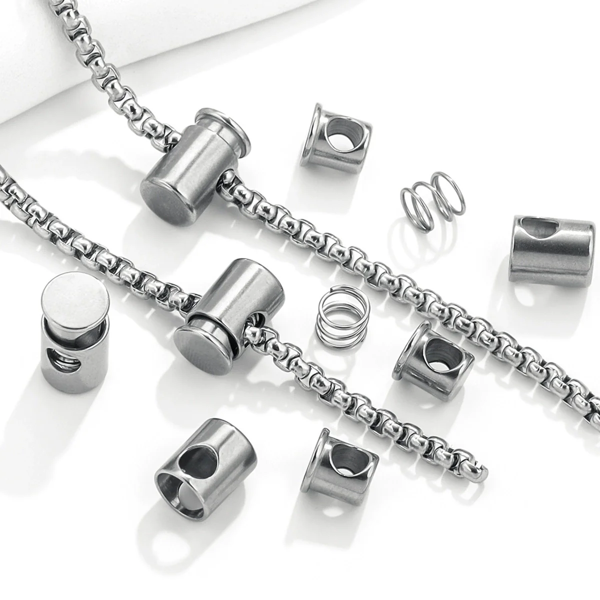 Stainless Steel Bell Elastic Spring Push Pull Adjustment Titanium Steel Buckle Accessories Handmade Chain Positioning Button With Hirback Pattern And Electroplating Treatment