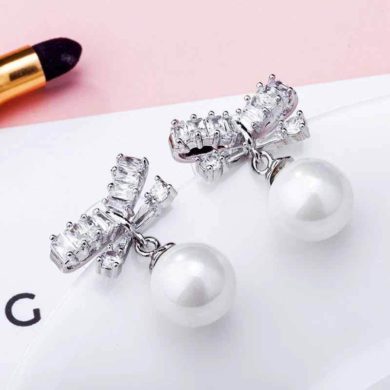 Wholesale Alloy Constellation Diamond Inlaid Zircon Bow Pearl Earrings - Image 7