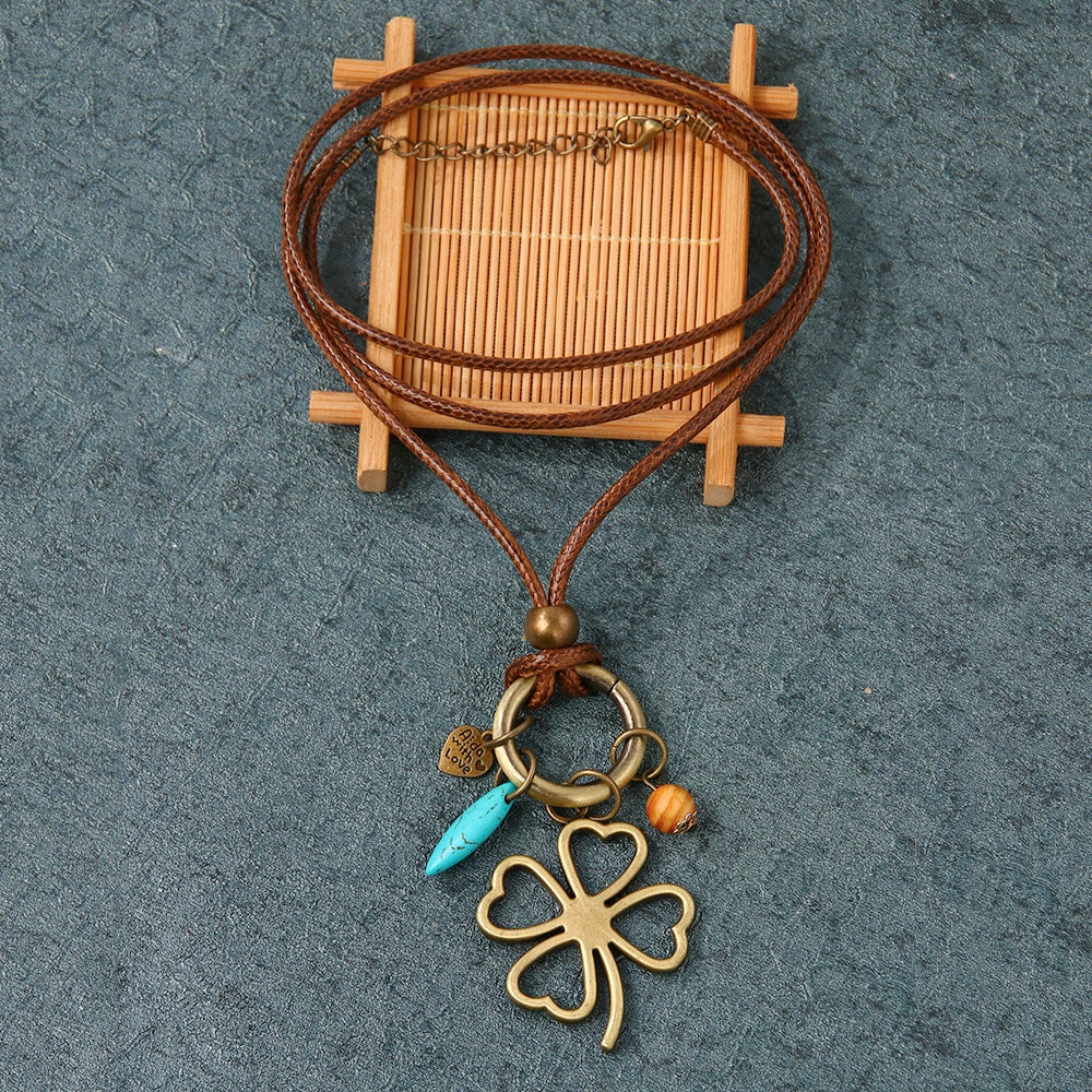 Wholesale Alloy Leaves Four Leaf Clover Pendant Necklace With Electroplating Vintage Fashion Style Unisex
