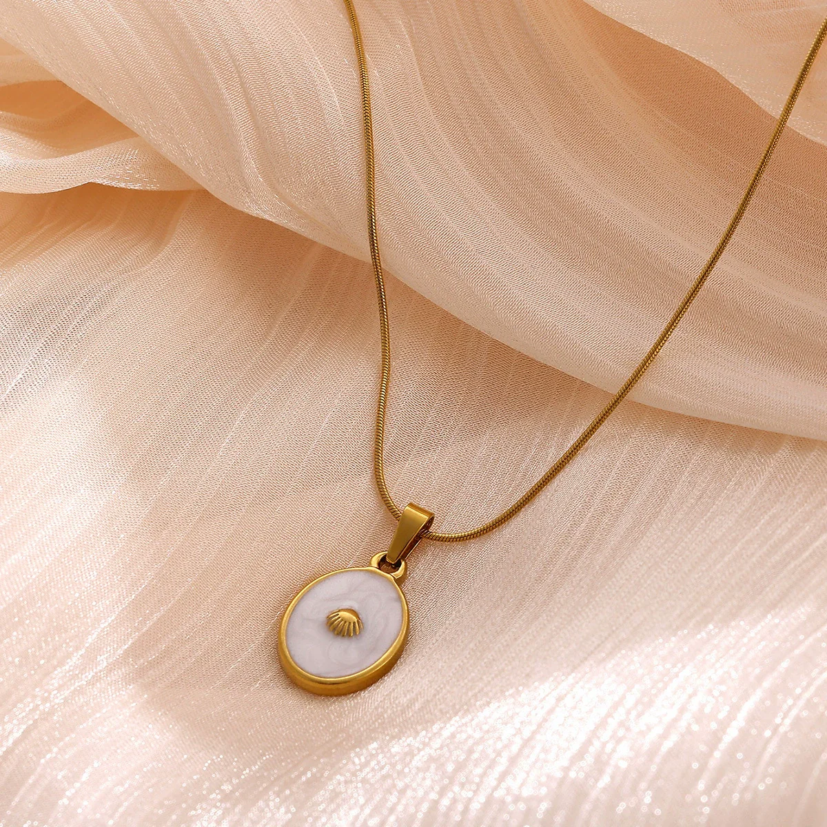 Wholesale Unisex Gold Electroplated Stainless Steel Scallop Inlaid Oval Cross Chain Necklace With White Enamel - Image 2