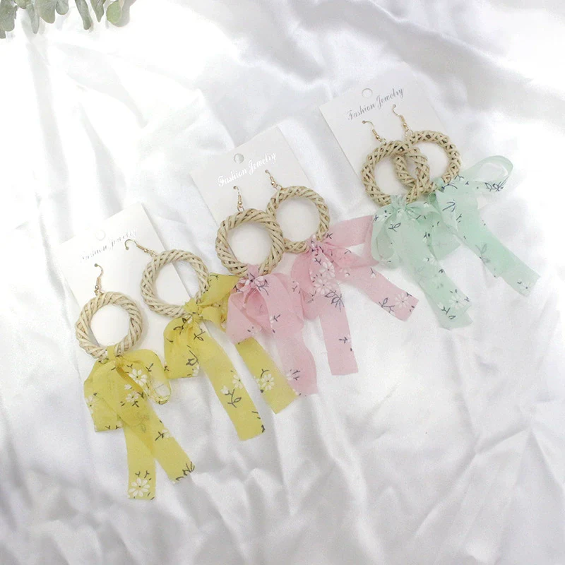 Wholesale Women's Bohemian Style Silk Straw Earrings With Doll Pattern And Ribbon Tassel