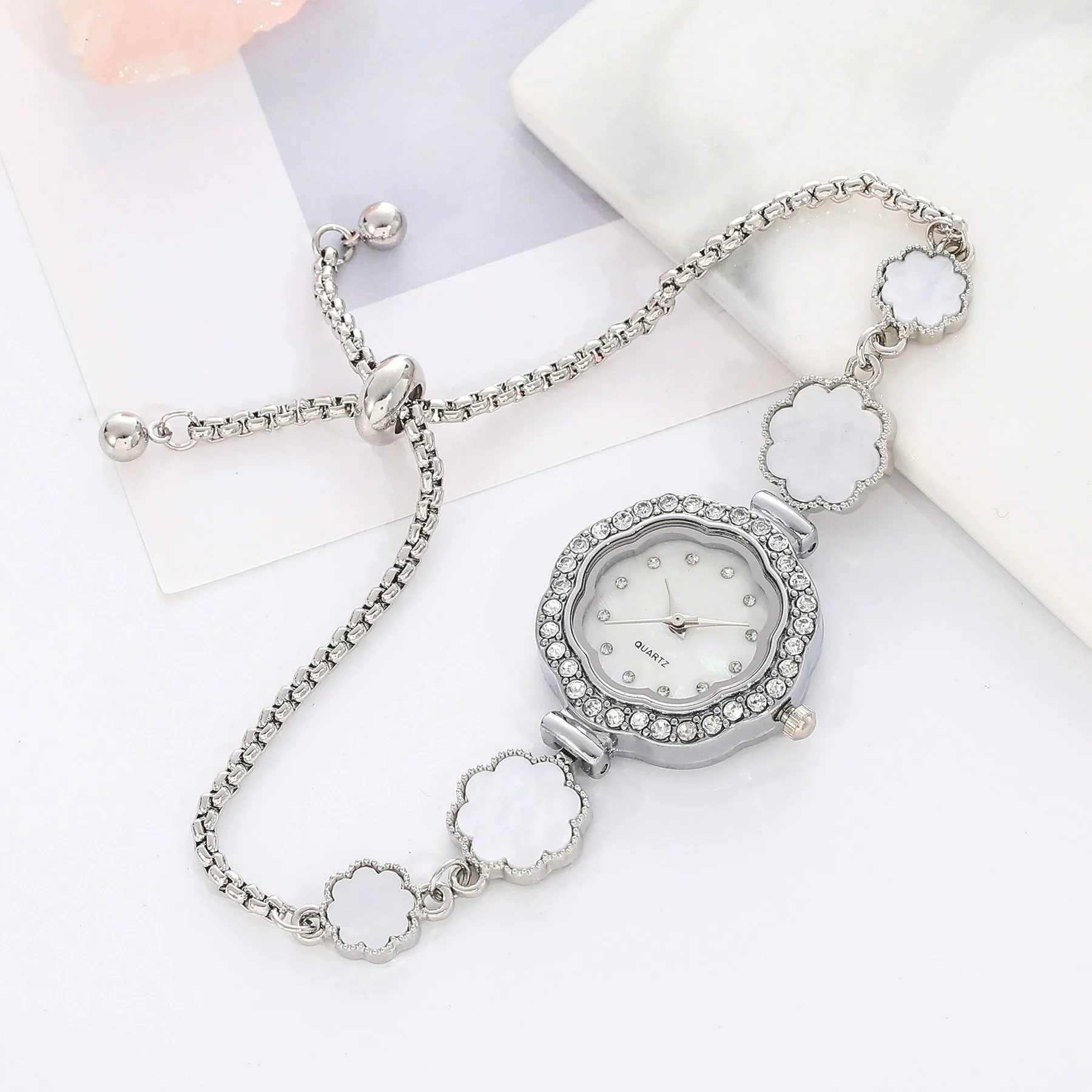 Wholesale Women's Fashion Quartz Watch With Diamond And Plum Blossom Diecast Case And Strap Titanium Clasp Flower Shaped Dial