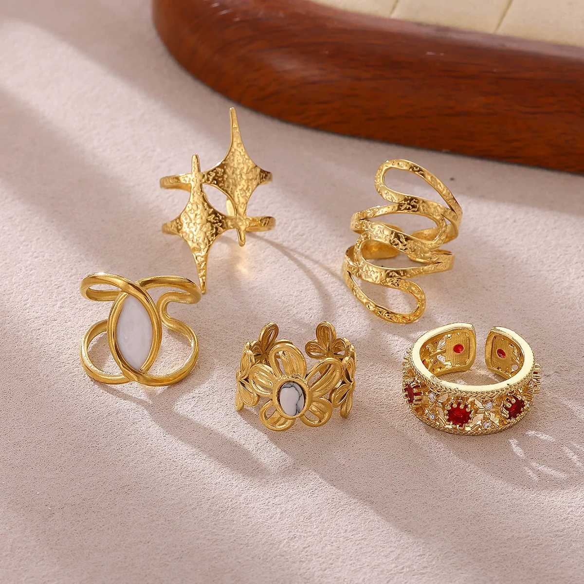 Wholesale Women's Geometric Hollow Flower Goldplated Inlaid With Gold Stainless Steel Zircon Ring With Fruit Shape And Pattern Light Luxury Style