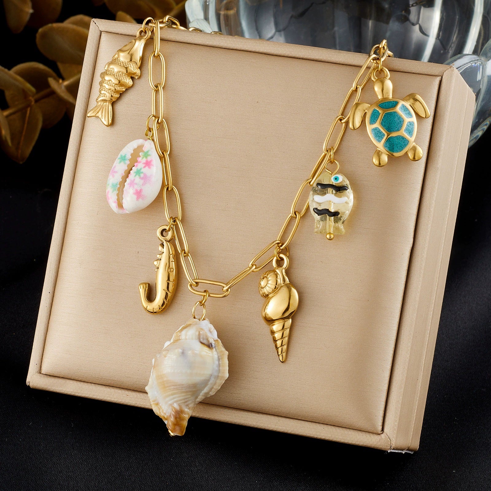 Wholesale Women's Goldplated Stainless Steel Marine Life Conch And Small Fish Pendant Necklace With Flat Cross Chain