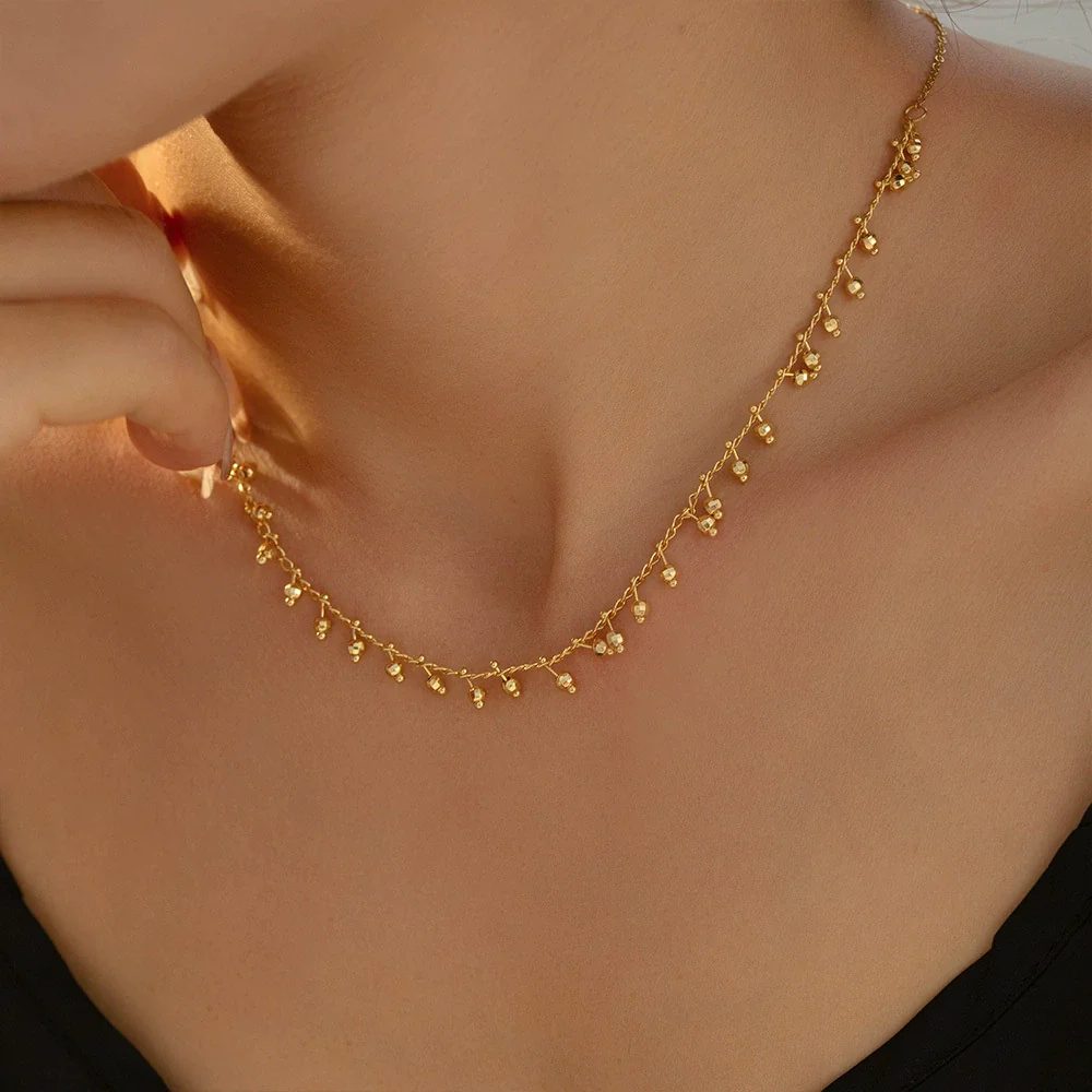 Wholesale Women's Light Luxury Geometric Copper And Titanium Steel Plated 18K Gold Round Ball Stitching Gourd Tassel Pendant Necklace