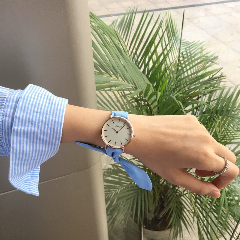 Women's Alloy Case Cloth Belt Round Dial Printed Logo Canvas Strap Leisure Watch